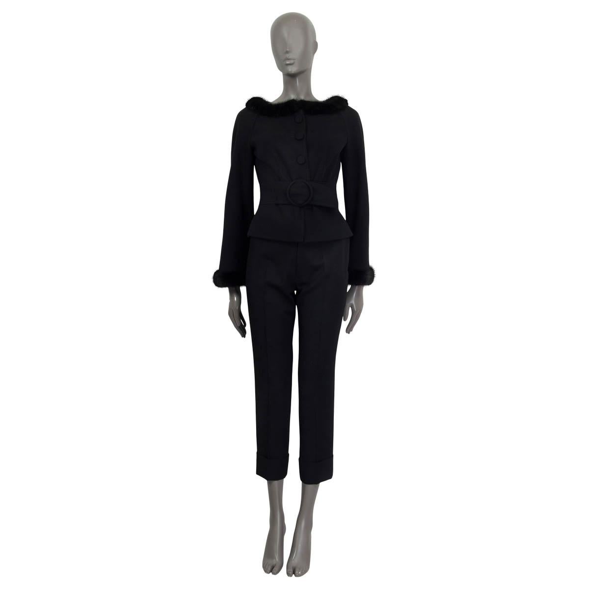 100% authentic Valentino long sleeve blazer in black virgin wool (98%) and elastane (2%). Embellished with a mink boat neck and mink cuffs (assumed because tag is missing). Features a belt and opens with four black buttons on the front. Lined in