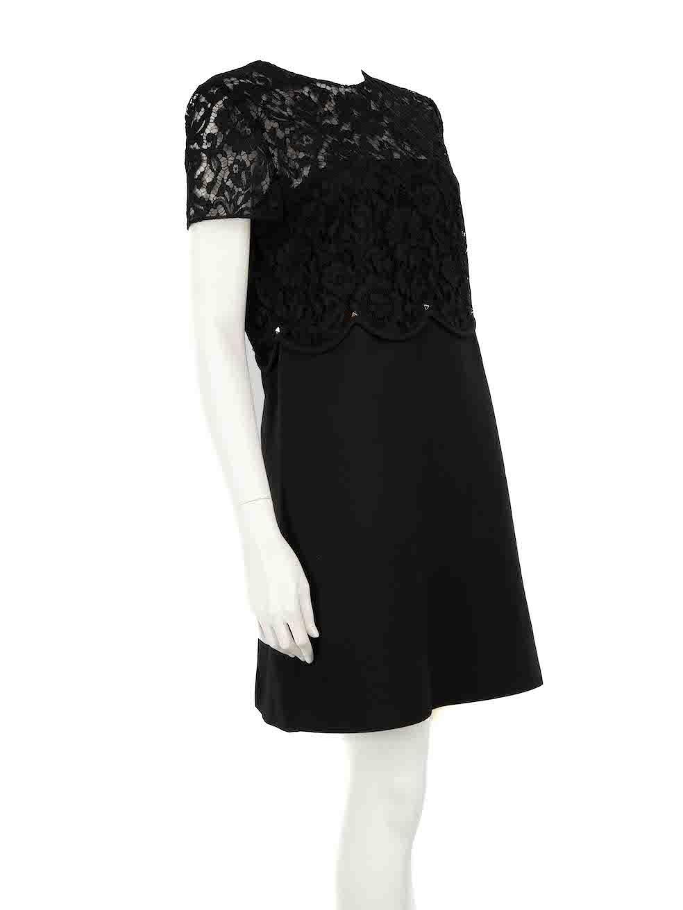 CONDITION is Very good. Hardly any visible wear to dress is evident on this used Valentino designer resale item.
 
 
 
 Details
 
 
 Black
 
 Wool
 
 Dress
 
 Top lace sheer panel
 
 Rockstud accent
 
 Mini
 
 Round neck
 
 Short sleeves
 
 Back zip