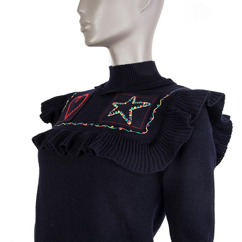Valentino embroidered ruffled sweater in midnight blue virgin wool (100%) with 3/4 sleeves and a mock neck. Has been worn and is in excellent condition.

Tag Size S
Size S
Shoulder Width 34cm (13.3in)
Bust 82cm (32in) to 90cm (35.1in)
Waist 80cm
