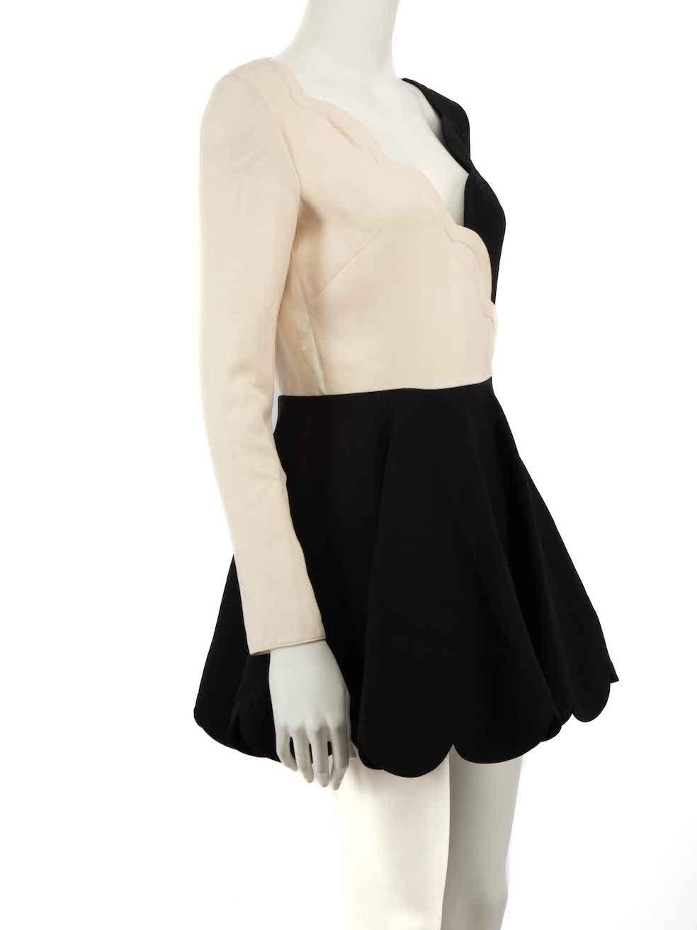 CONDITION is Good. General wear to dress is evident. Moderate signs of wear to the white panels with discoloured marks on this used Valentino designer resale item.
 
 Details
 Black
 Wool
 Dress
 Long sleeves
 Mini
 Cream panel
 Scallop hem
 Back