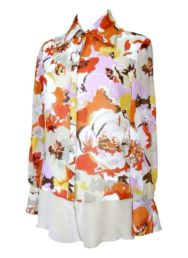 Guaranteed authentic exquisite Valentino silk blouse.
Beautiful abstract flower print in rusts, gold, brown, lavender, taupe and beige.
2 button 4