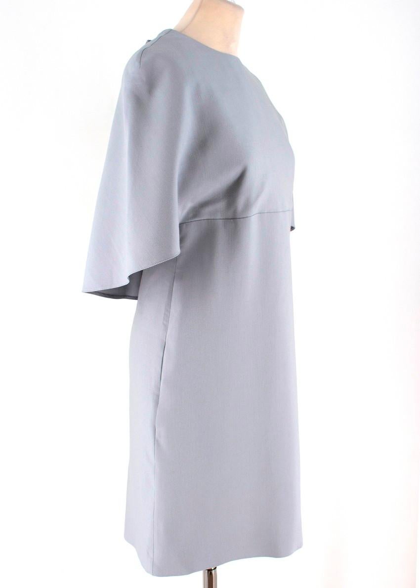 Valentino Wool & Silk-blend Cape Dress

- Grey-blue silk & wool-blend dress
- Concealed rear fastening from the waist down and button fastening at the back of the neck
- Lined
- Open back
- Cape style 

IT 42
Approx.
Length: 90cm
Waist: 38cm