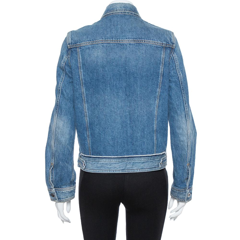 We love this denim jacket from Valentino! Made with fashion in mind, the jacket comes in a comfortable design with full front buttons, chest pockets, and a patch pocket detailed with signature studs. The stylish number is a must-have for your casual