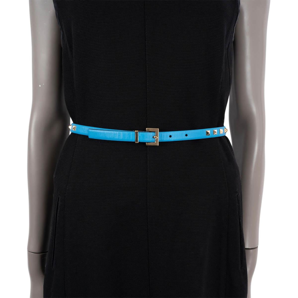 100% authentic Valentino Rockstud 15mm waist belt in blue smooth calfskin with signature light gold-tone metal studs.  Has been worn and is in excellent condition.


Measurements
Tag Size	75
Fits	72cm (28.1in) to 77cm (30in)
Length	89cm
