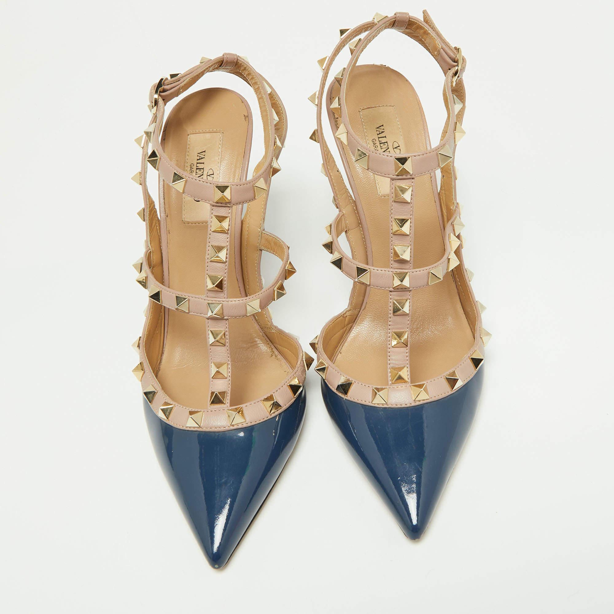 Instantly recognisable, the Rockstud sandals from Valentino are one of the most iconic styles from the brand. These sandals have been crafted from blue & pink leather & patent leather and styled with the signature Rockstud accents on the straps.