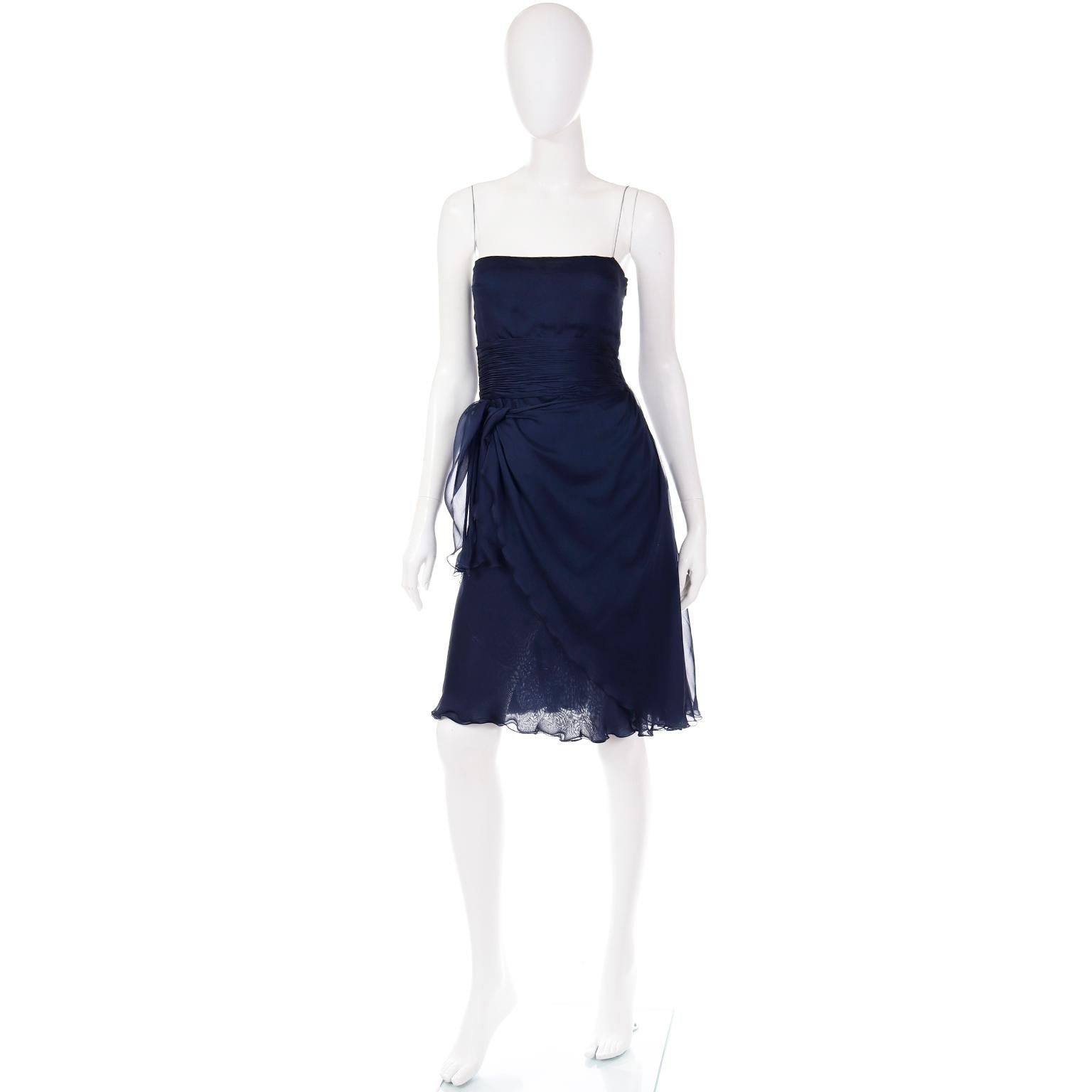 This elegant Valentino blue silk chiffon dress has such beautiful movement when worn. Designed by Valentino Garavani in the early 2000's, this is a perfect dress to add to any wardrobe. The luxe silk chiffon fabric is so fine and we love the deep,