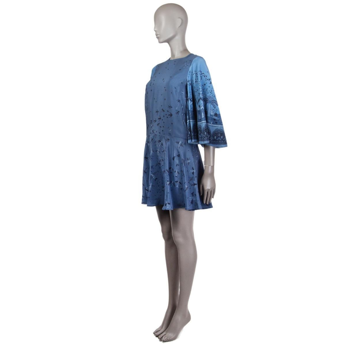 Valentino dress in soldier and pigeon blue silk (100% - content tag is missing) with bell sleeves. Zandra Rhodes bird print inspired by Hieronymus Bosch for Spring 2017. Closes with a concealed zipper and a hook on the back. Has been worn and is in