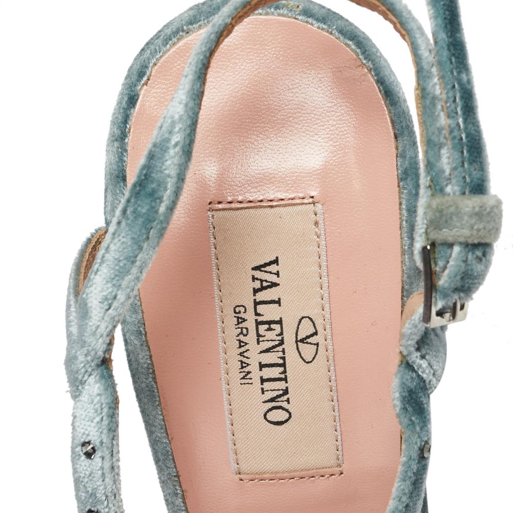 Defined by luxe cuts, unique details, durable built, and a blue hue, this pair by Valentino has all the qualities of a fashionable shoe. Crafted from smooth velvet, they have peep-toes, slingbacks, and heels with 11.5 cm heels.

Includes: Original