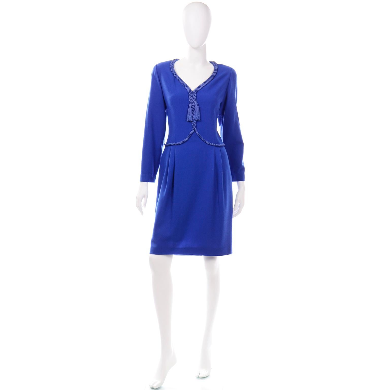 This is a beautifully made vintage Valentino Miss V Blue wool crepe dress with lovely rope trim and tassels.This timeless V neck dress is fully lined and has built in shoulder pads for structure. The dress closes with a back center zipper and was