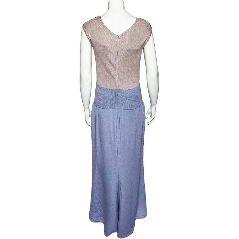 A Valentino dress like this can easily take you through season after season. It has an elegant paneled design with a contrasting bodice and skirt. You can wear this sleeveless maxi dress with slingback sandals and a shrug.

