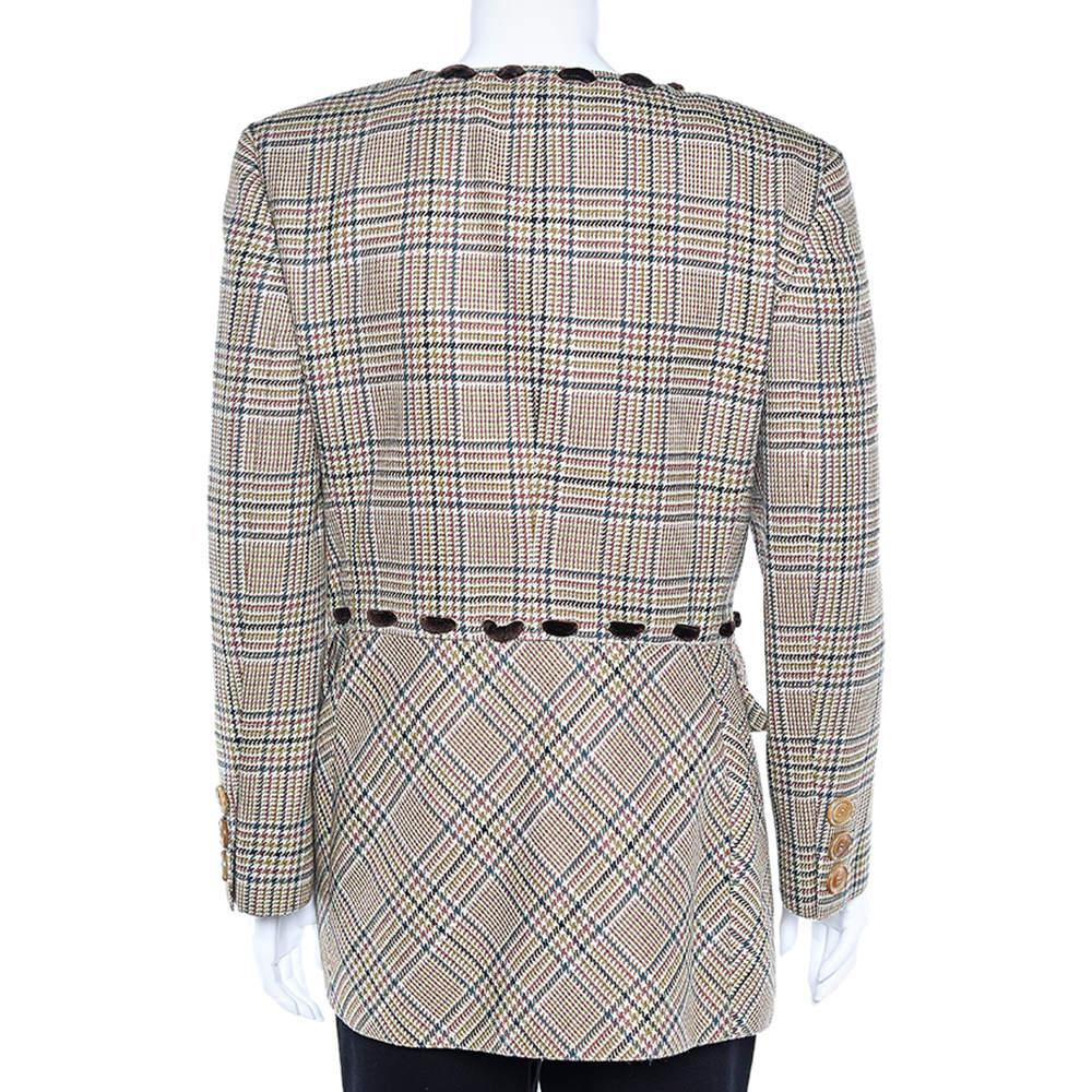 Embrace boldly feminine and graceful styles like this blazer and emanate nothing but elegant vibes. From Valentino Boutique, this Prince Of Wales blazer is meticulously stitched using beige Checked wool and flaunts buttoned closure. It has two