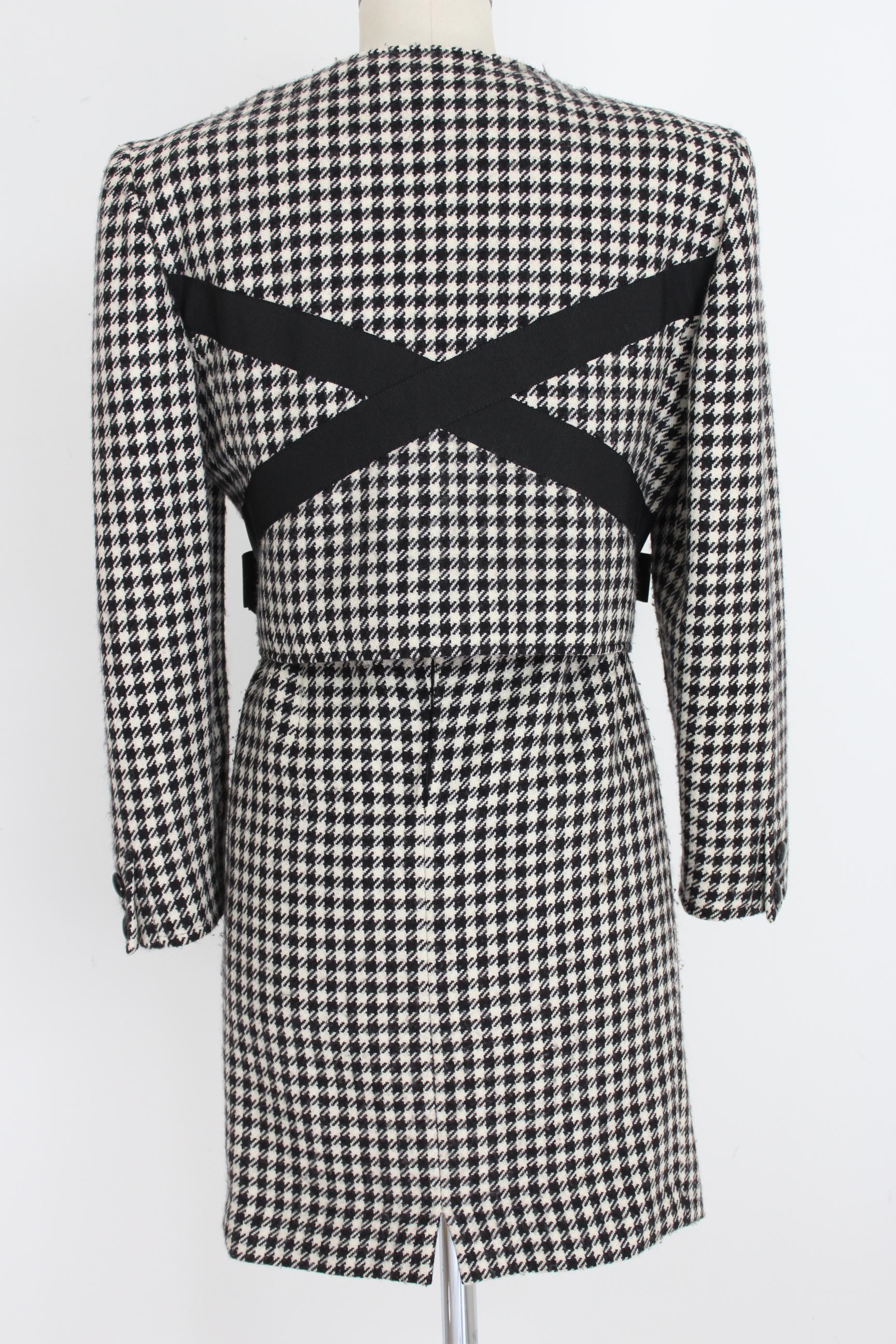 Valentino Boutique 80s vintage women's skirt suit. Houndstooth patterned suit, black and white color. Short jacket at the waist with zip closure, bows on the sides. Straight pencil skirt. 100% wool. Made in Italy. Excellent vintage