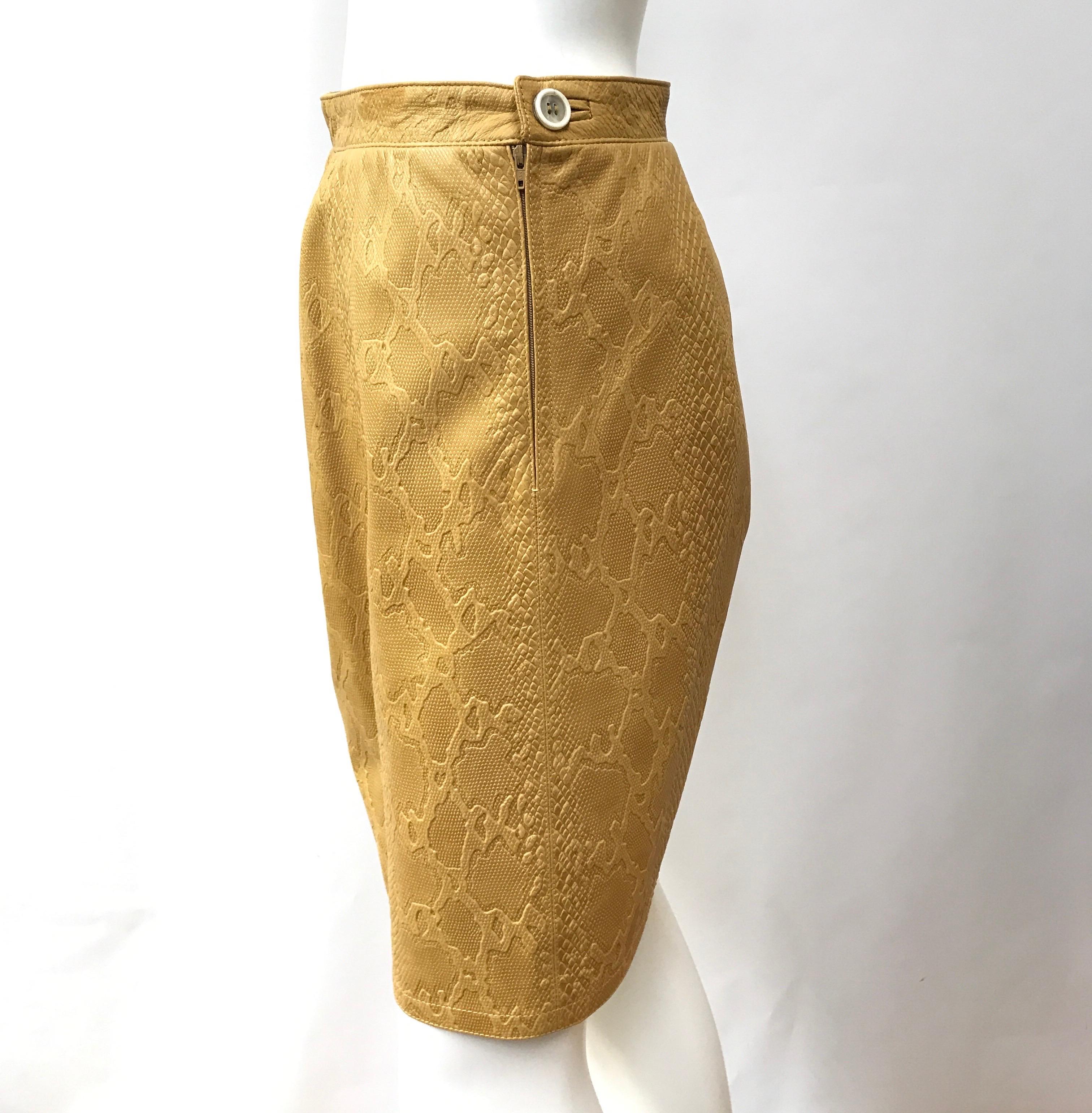 Valentino Boutique Camel Embossed leather skirt-4. This amazing Valentino Boutique skirt is in excellent condition. It is camel color and is an embossed leather throughout. There is a side zipper and fastened button, as shown in pictures. This skirt