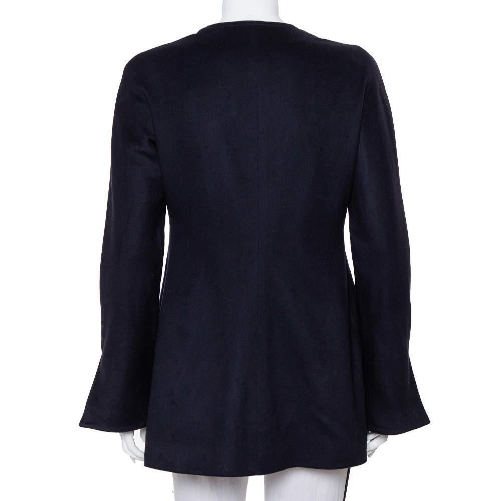 Valentino creations exude a sense of refined elegance and timeless allure. This vintage jacket is a testament to how the brand's creations will stay relevant through the years. It has been crafted from midnight blue cashmere and is cut to deliver a