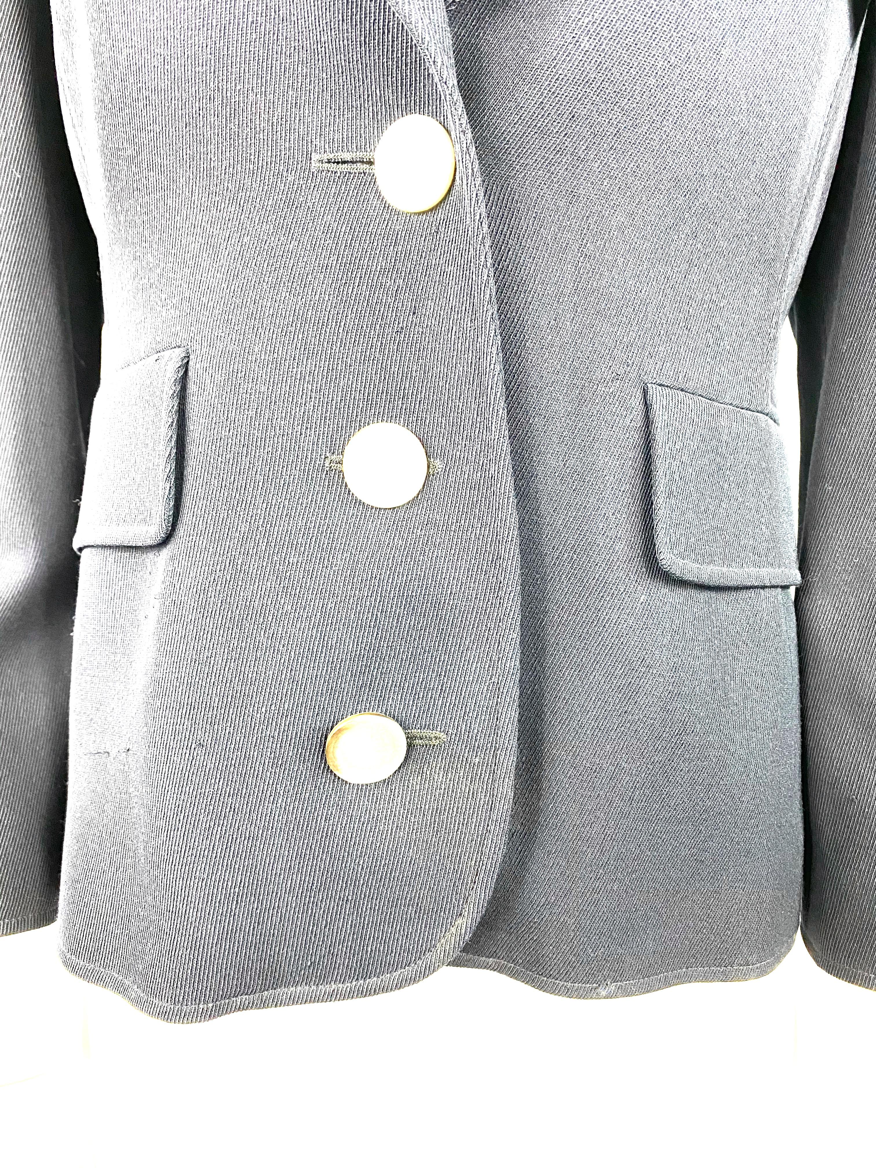 Product details:
Featuring collar, 3 front pockets, 3 large front buttons closure, 2 buttons detail on each sleeve, half rear belt detail with 2 buttons and ruffle detail on the back.
Made in Italy.
Size 6.