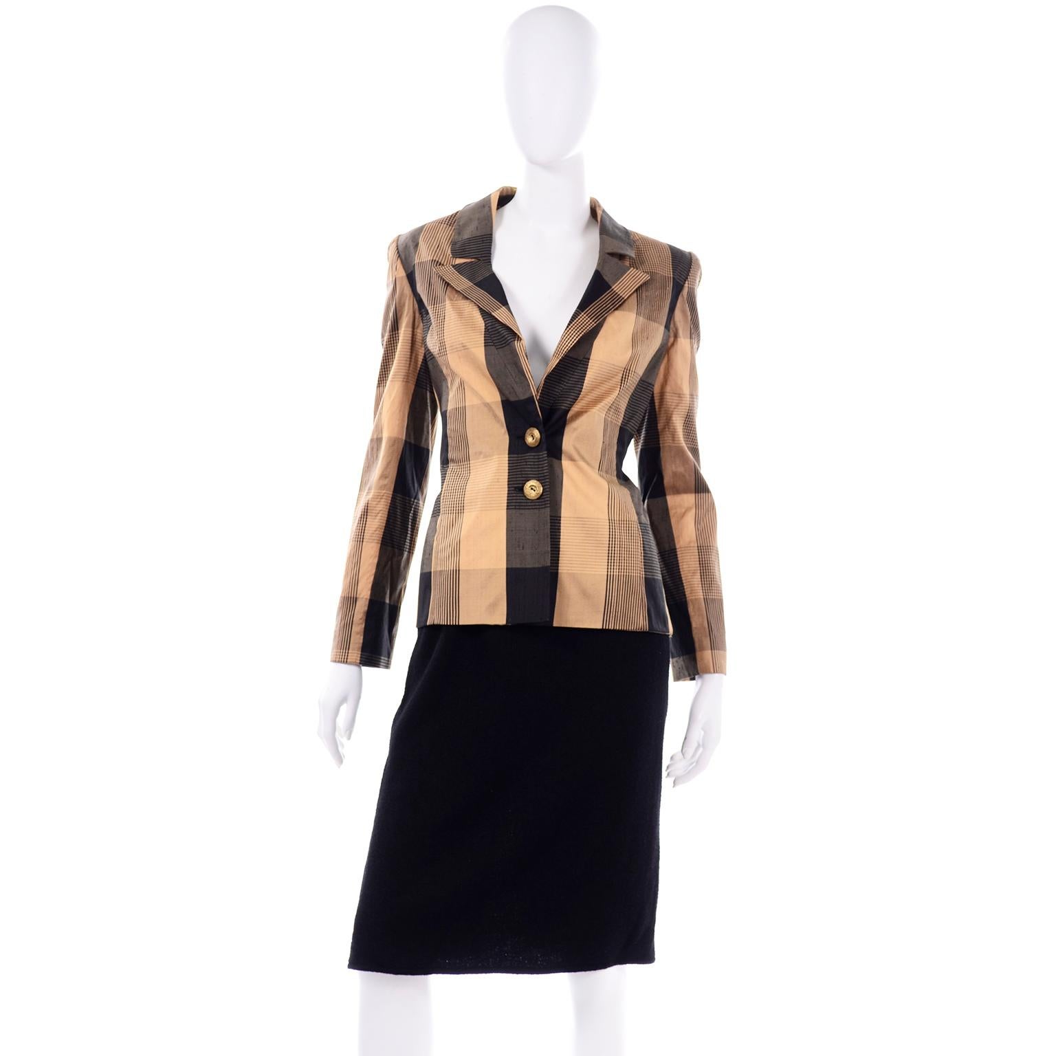 This vintage Valentino Boutique Collectible skirt suit ensemble comes with 2 different blazer options. This includes a vintage Valentino black boucle wool skirt and both a black boucle wool blazer and a coordinating black and gold plaid silk blazer.