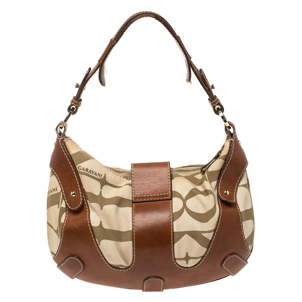 This striking hobo bag by Valentino is perfect for everyday use. It has been crafted from canvas and leather and comes in versatile shades of brown & cream. It has a single handle, a strap that carries the brand logo, and a spacious satin-lined