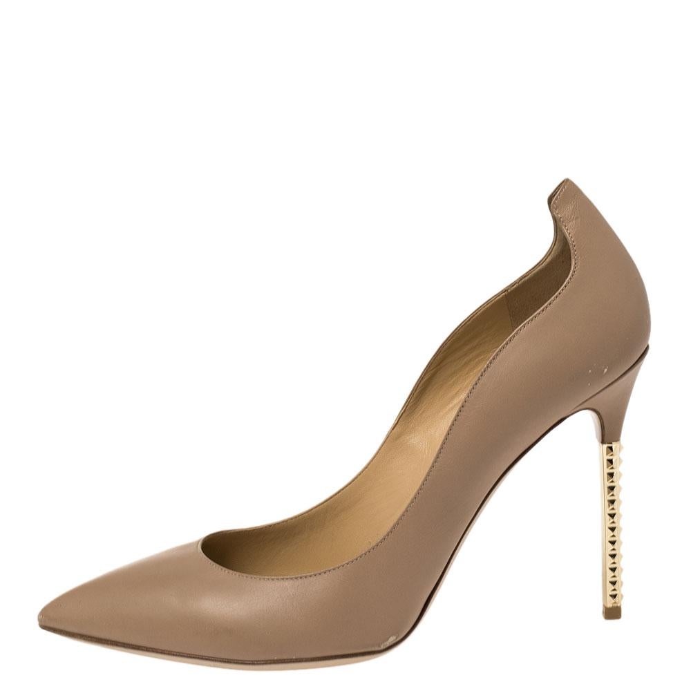 Look refined and sophisticated by flaunting this pair of leather pumps. These pumps from Valentino have pointed toes and gold-tone stiletto heels. These fascinating brown pumps will elevate the look of any of your favorite outfits.

Includes: