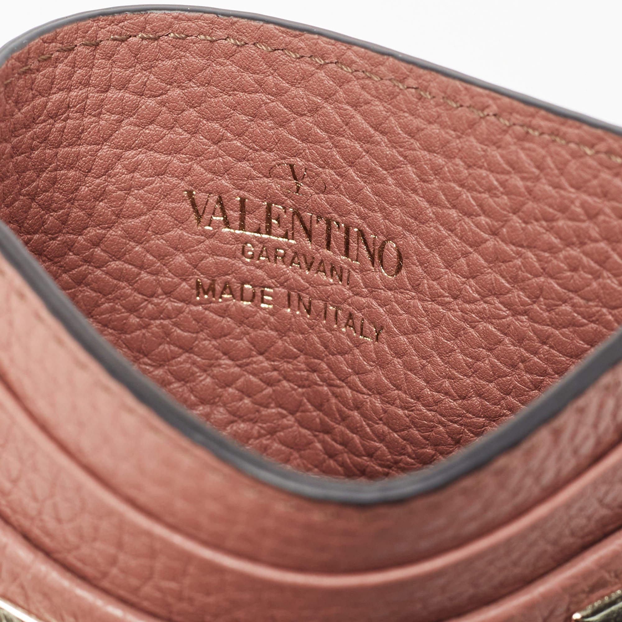 This Valentino cardholder is carefully crafted to offer you a luxurious accessory you will cherish. It is marked by high quality and enduring appeal. Invest in it today!

Includes: Original Box, Info Booklet, Extra Embellishments
