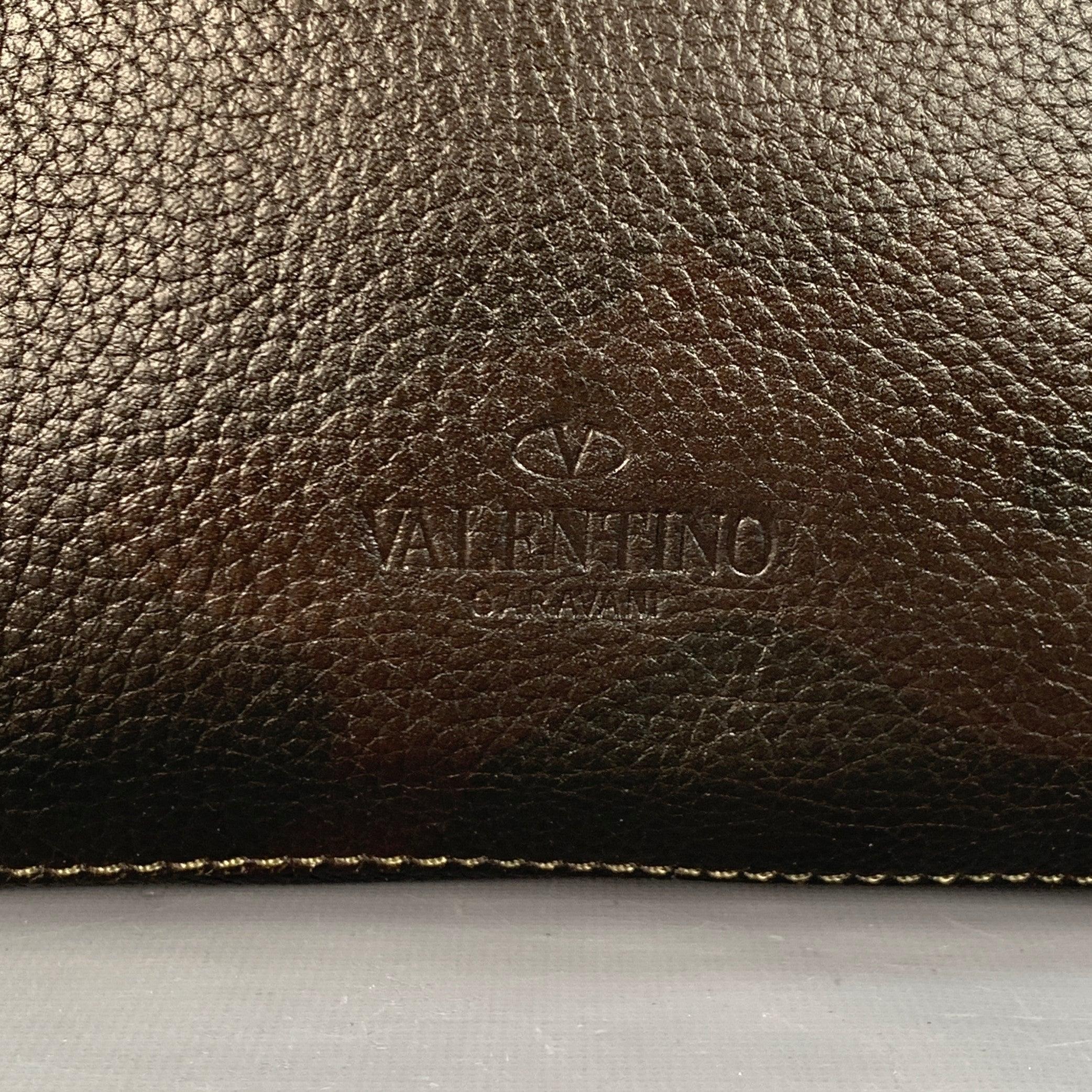 VALENTINO clutch
in a brown and olive green pebble grain leather featuring a camouflage pattern with ombre design, red and white contrast zipper trim, and zip up closure. Made in Italy.New with Tags. 

Measurements: 
  Length: 11 inches Width: 2
