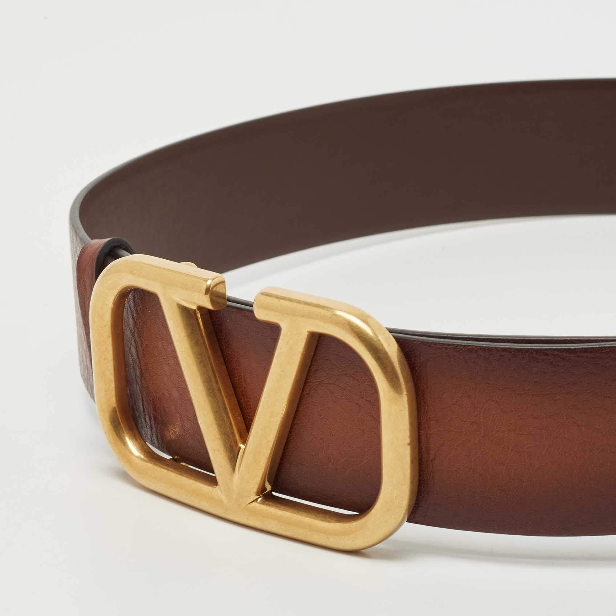Belts are fine accessories to upgrade any basic look to a statement-making one. We particularly love this offering by Valentino. Formed using leather, the brown belt has a VLogo buckle for an impeccable finish.

Includes: Original Dustbag, Original