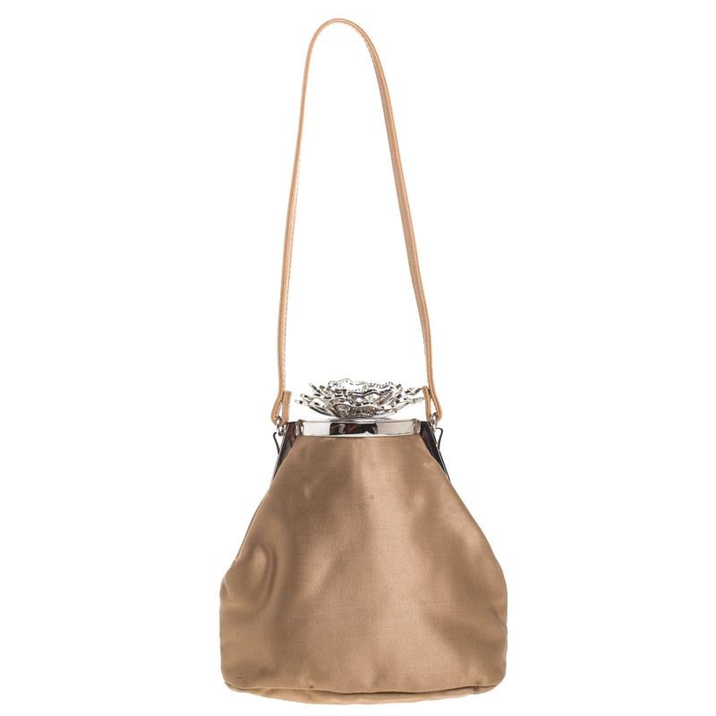 Be a trendsetter with this luxurious bag from the house of Valentino. Crafted with lush satin that imparts a soft feel, this chic bag is characterized by shiny crystal embellishments all over and a wonderfully-designed top that gives a glamorous