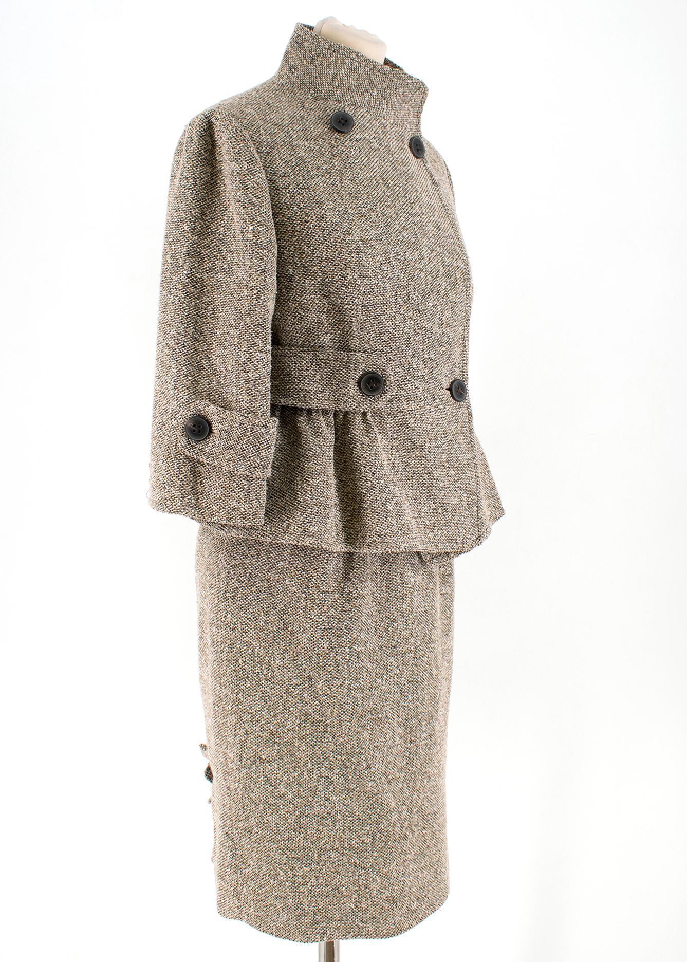 Valentino Brown Silk Blend Tweed Jacket and Skirt Set

Jacket:
 
- Double breasted buttoned closure at front and cuffs
-  Stand-up collar
- 3/4 length sleeves
- Ruffled bottom hem
- Seamed buttoned waist strap

Skirt:

- Gathered waist
- Concealed