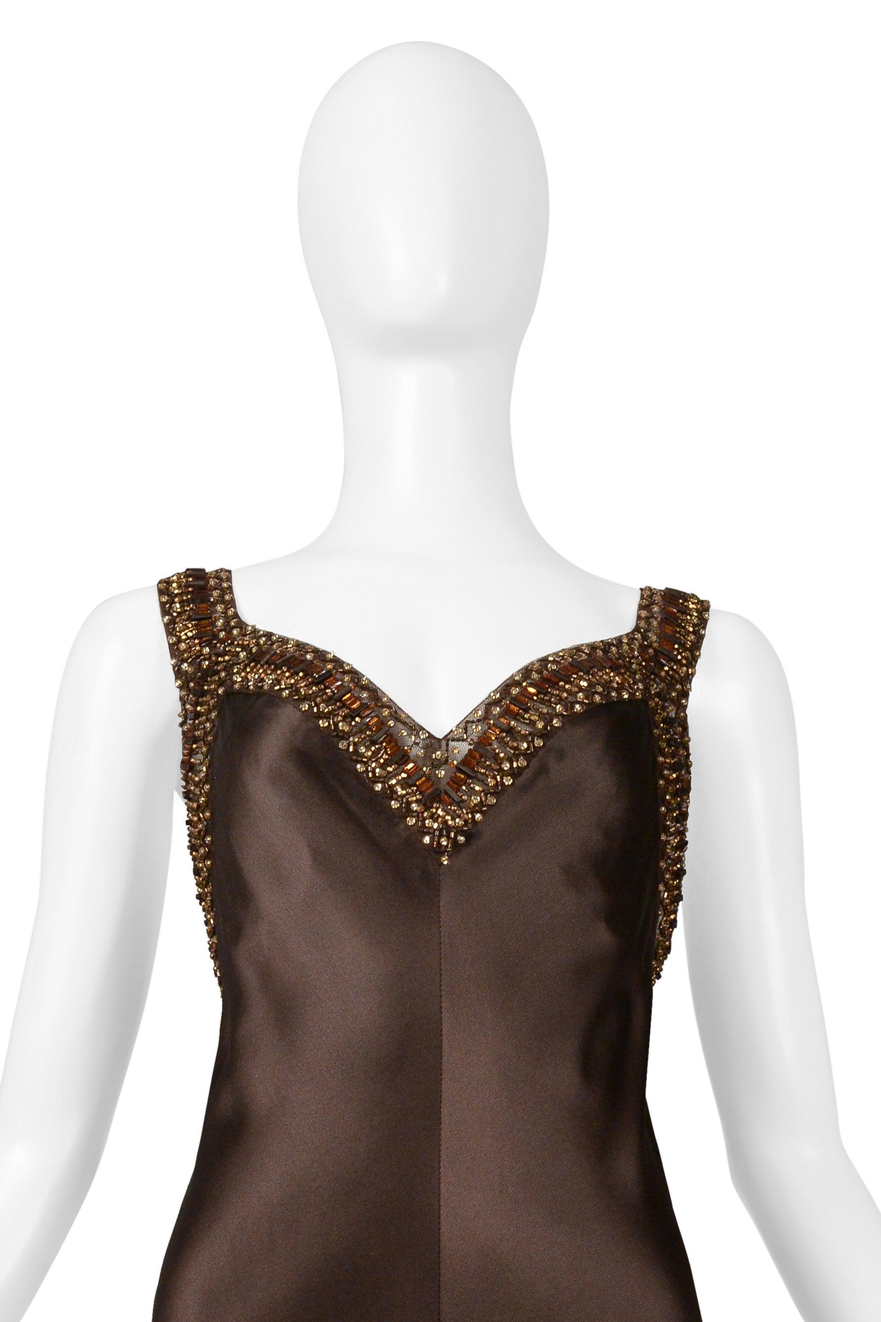 Resurrection Vintage is excited to offer a vintage Valentino brown silk evening gown featuring gold and bronze layered beading along edges, beaded shoulder straps, v- neck, above-the-knee slit at the center front, sexy low back, and dramatic evening