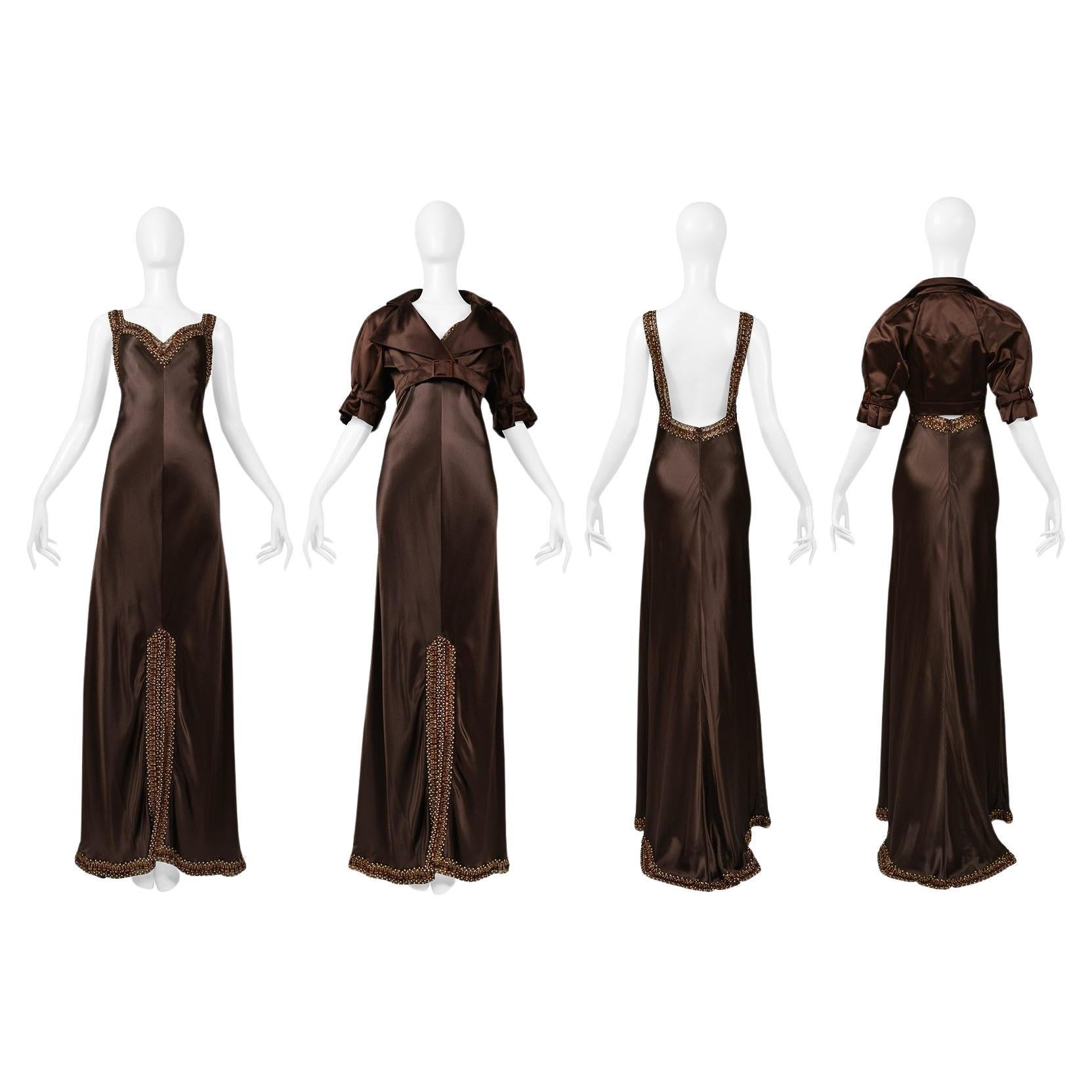 Resurrection Vintage is excited to offer a vintage Valentino brown silk gown and jacket ensemble. Gown features dramatic evening gown length, sexy low exposed back, thick row of gold and bronze beading on straps and outlining of edges, and above the