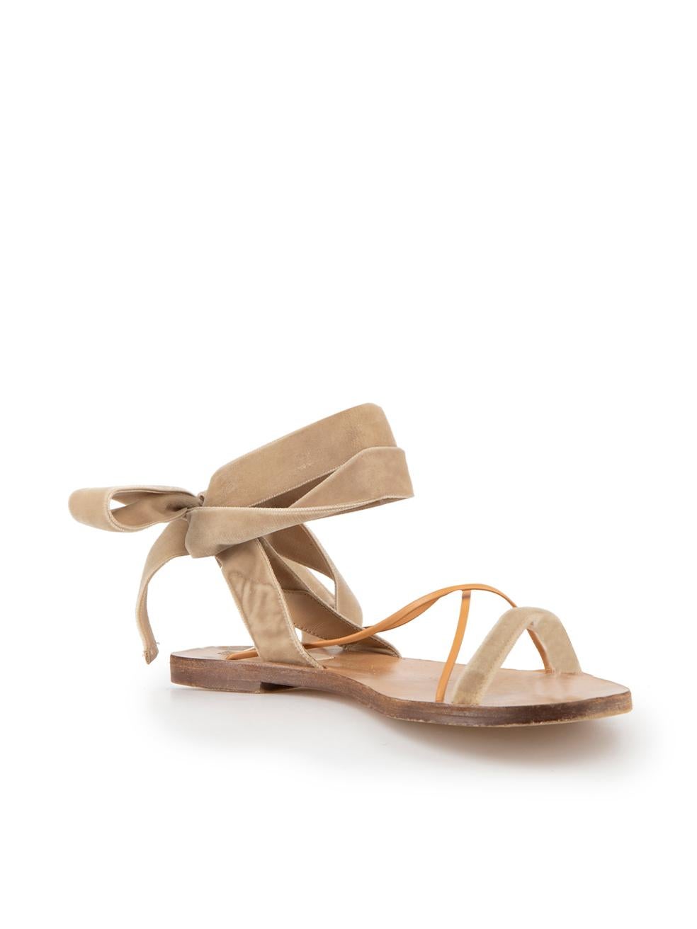 CONDITION is Good. Minor wear to shoes is evident. Light wear to the footbeds of both shoes with marks and abrasions, particularly at the toes on this used Valentino designer resale item.
 
 Details
 Brown
 Velvet
 Strappy sandals
 Open toe
 Falt