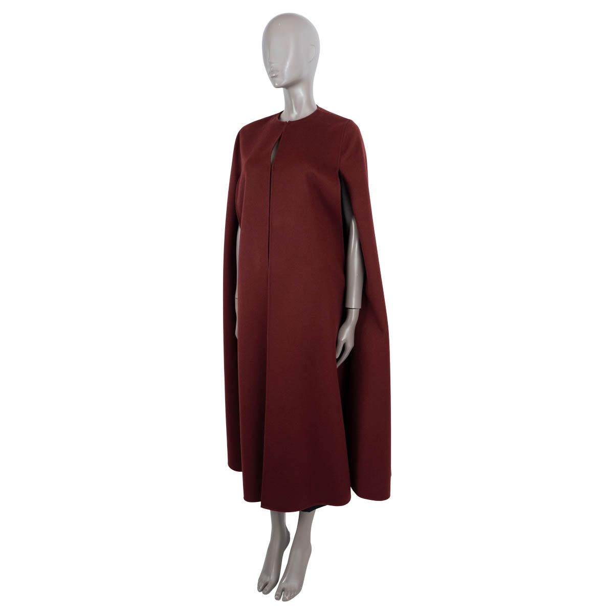 100% authentic Valentino maxi cape in burgundy wool (95%) and cashmere (5%). Features a sleek, collarless silhouette. Unlined. Has been worn and is in excellent condition.

2020 Resort

Measurements
Model	TB3CG1N515E
Tag Size	38
Size	XS
Shoulder