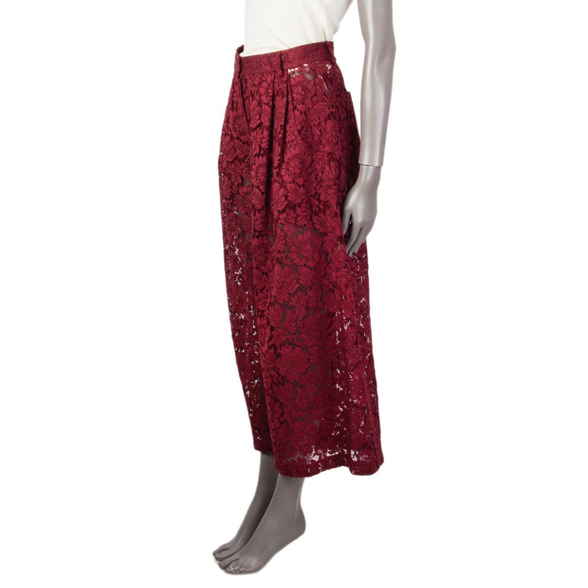100% authentic Valentino Guipure lace trousers in burgundy missing tag (probably cotton) with wide legs, a pleated waist. high rise and slit pockets in the front. Closes with a hook and bar and zipper in the front. Lined with shorts in (probably