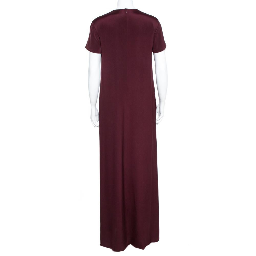 An elegant and urbane piece like this Valentino maxi dress deserves a special place in your wardrobe. A pretty number like this burgundy piece requires minimal effort to look like a million bucks. Womanly and stylish, this silk attire is a classic
