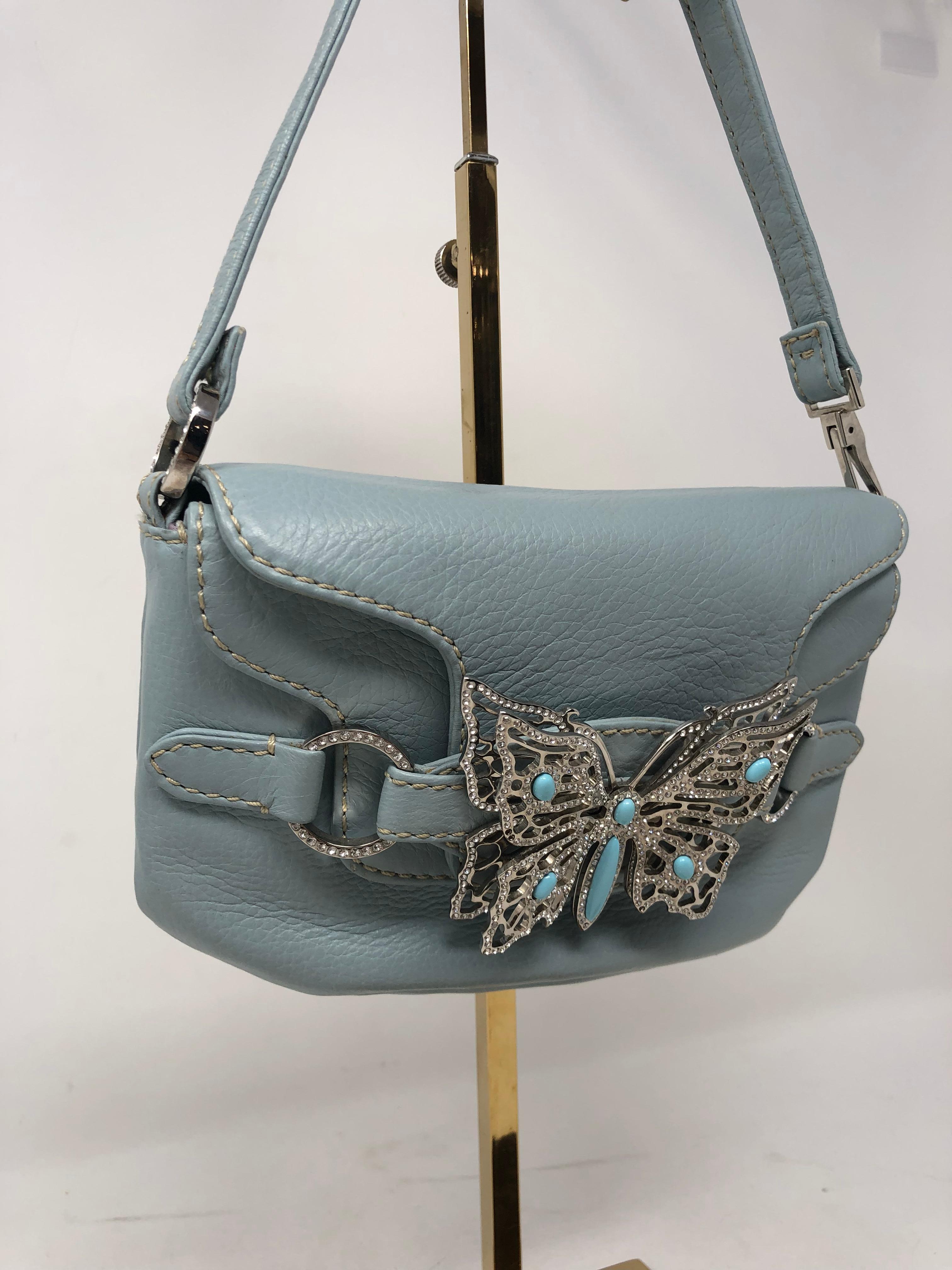 Valentino Mini Bag with Butterfly details. Stunning Butterfly with turqoise beads inlaid with rhinestones. Mint condition. Sweet little evening bag in all soft blue leather. Rare and limited bag. Make a statement any where you go. Classic Valentino
