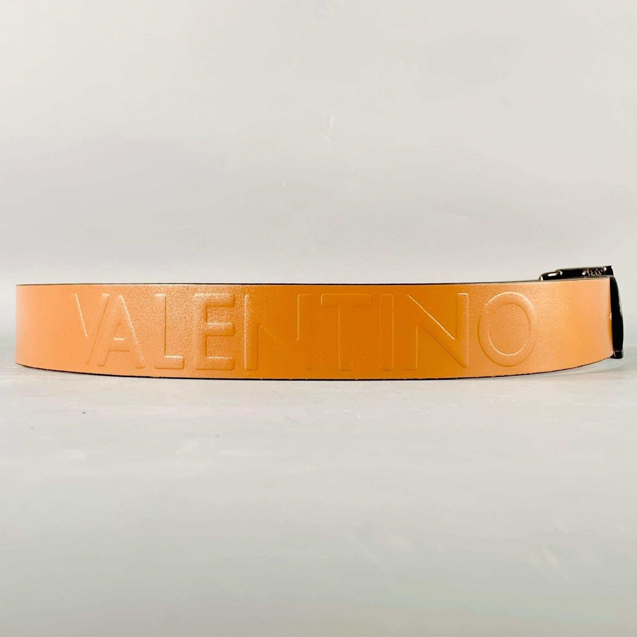 VALENTINO by MARIO VALENTINO belt
in a brown leather featuring embossed brand name, and gunmetal tone metal monogram buckle. New without Tags. 

Marked:   36Length: 43.5 inches Width: 1.25 inches Fits: 36 inches  - 40 inches Buckle: 2.75 inches 
 