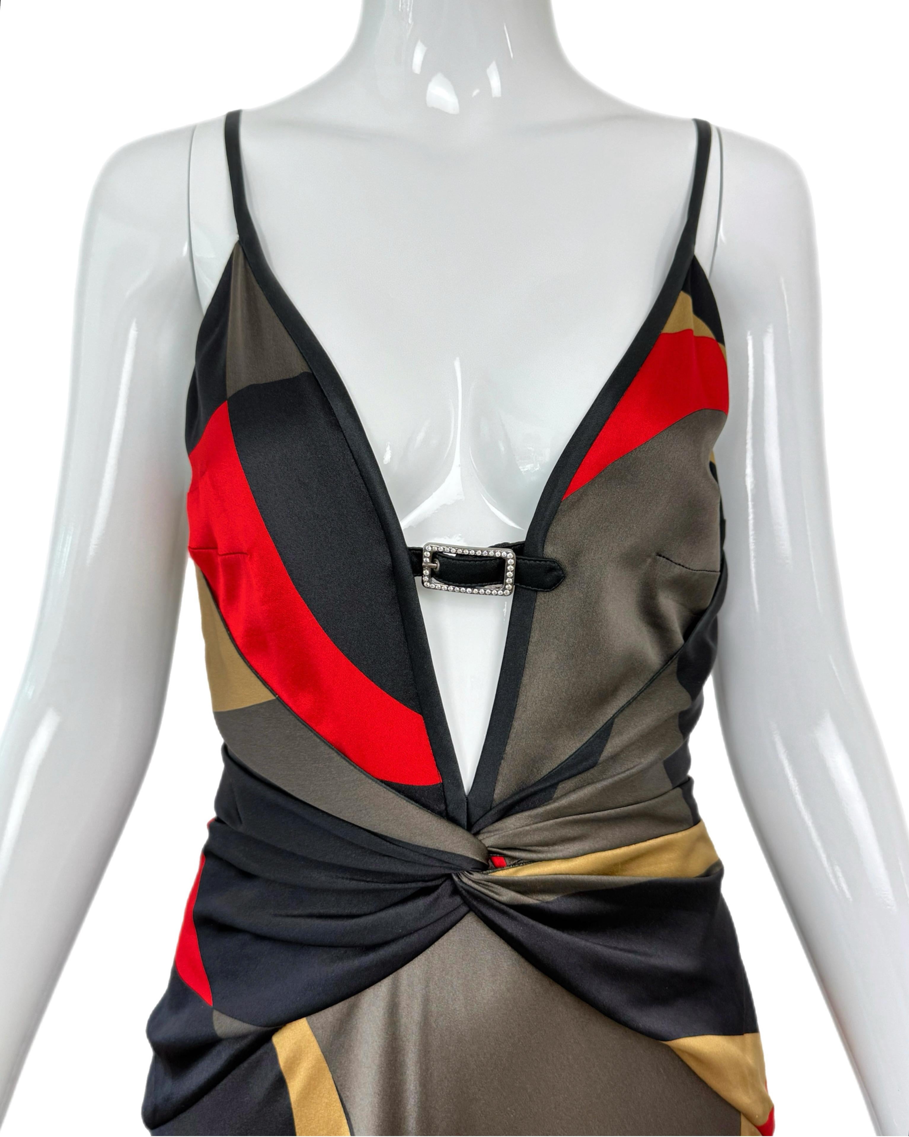 Valentino Garavani
Vintage
c. 2004 aso Jennifer Aniston at the Golden Globes January 5, 2004
Beautiful abstract pattern with rich colors
100% silk
Crystal buckle at deep v neck
Cinch waist effect
Wrap effect
Some pics clipped to mannequin
Size USA