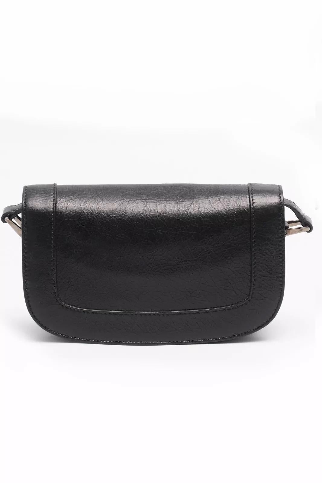 Valentino Garavani Supervee Crossbody Bag in black brushed calfskin. It features a dark silver V-logo, magnetic closure, an adjustable leather strap, and a leather interior with a patch pocket.

Color: Black
Material: Leather 
Silver Hardware 
Item