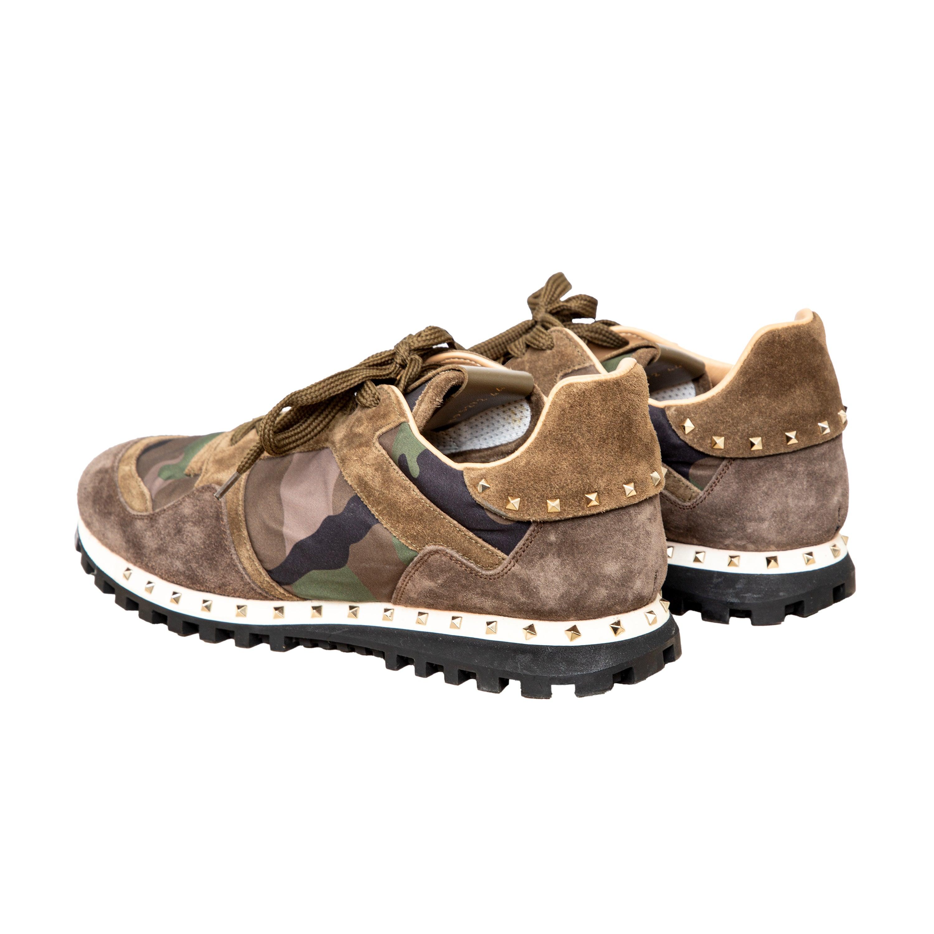 Elevate your style with our Valentino Camouflage Sneakers. Crafted with premium materials, these lace-up sneakers offer a comfortable fit and durable sole for everyday wear. The khaki camouflage print and stud detailing add a unique touch to any