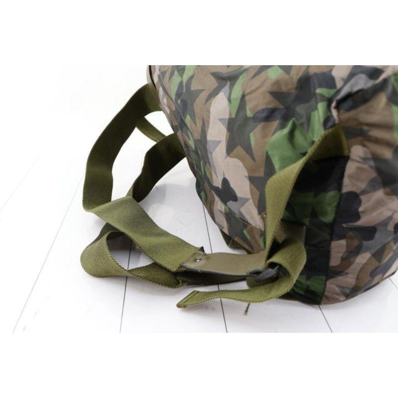 Valentino Camustars backpack features green Camouflage and black stars printed In Good Condition For Sale In Irvine, CA