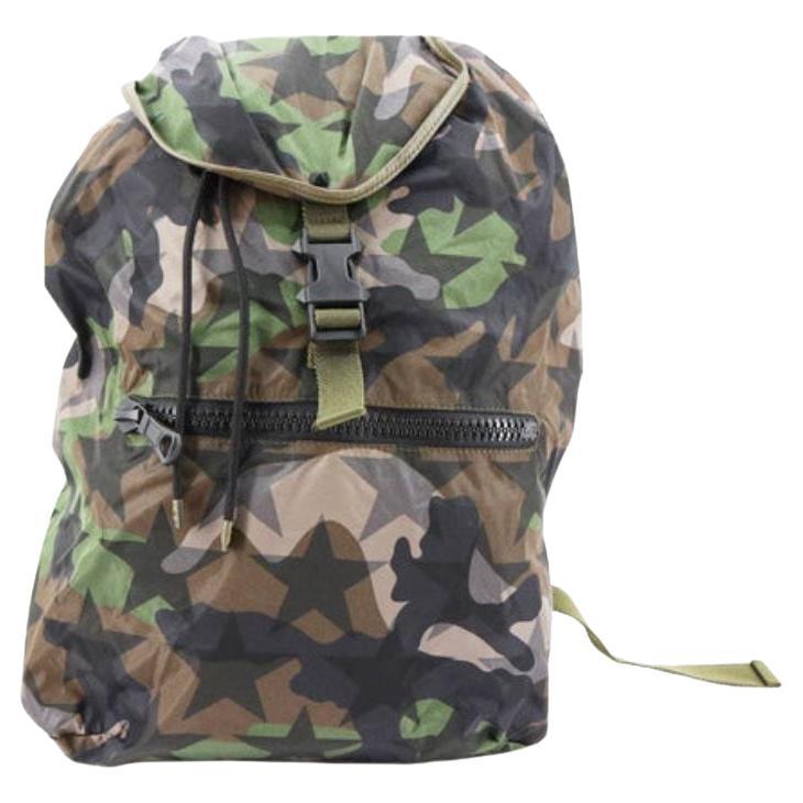 Valentino Camustars backpack features green Camouflage and black stars printed For Sale