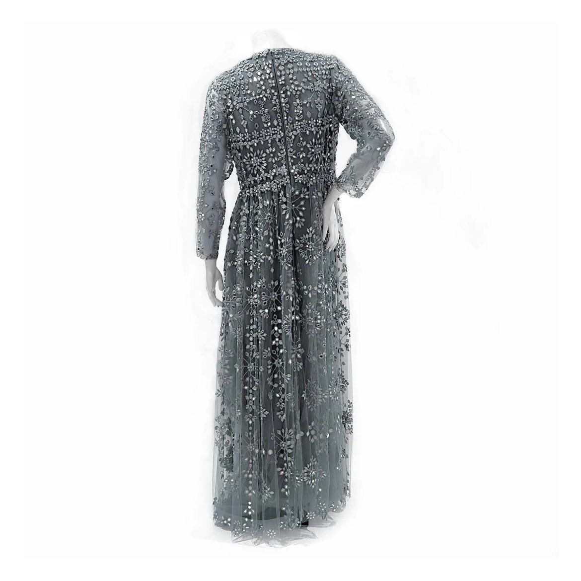 Valentino by Pier Paolo Piccioli Gown 
Made in Italy 
Blue chiffon tulle 
Silver mirror embellishment 
Mirror embellishment is in a geometric pattern 
Sheer tulle net long sleeves 
Floor length 
Full skirt 
Ballgown silhouette style dress
Horsehair