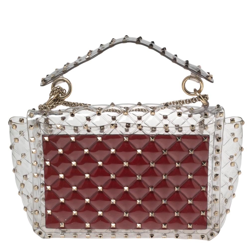 Make heads turn by swinging this super-stylish shoulder bag from Valentino. Crafted from clear PVC, it has a unique design and is decorated with gold-tone studs all over. It is complete with a top handle as well as a shoulder strap for effortless