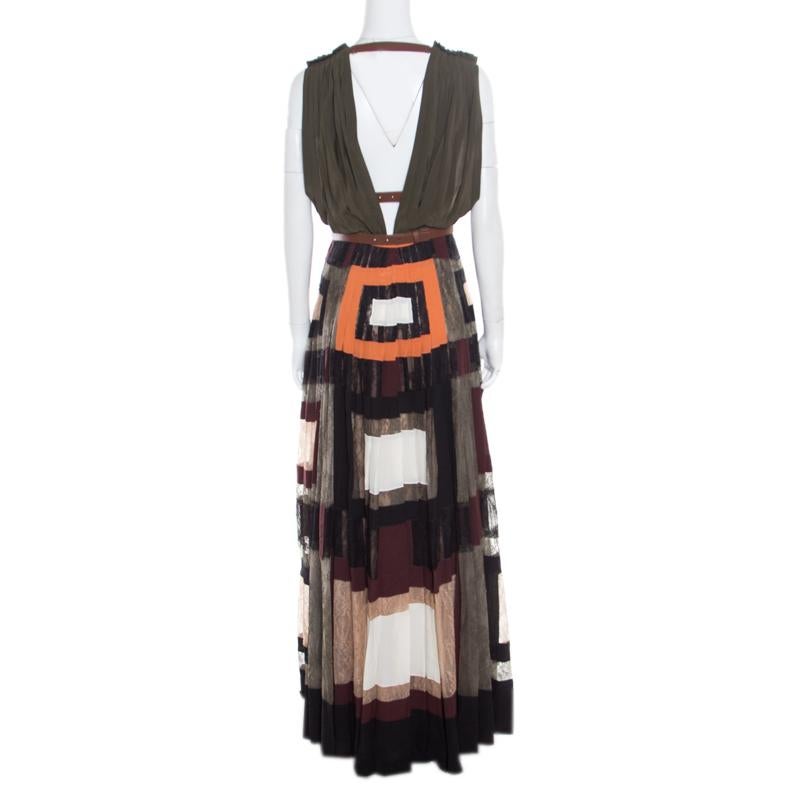 Valentino is known to bring out chic and stylish creations year after year and this maxi dress is no less charming! Made of 100% silk and styled with lace panels, it features a colorblock print all over and flaunts leather trims on the gathered