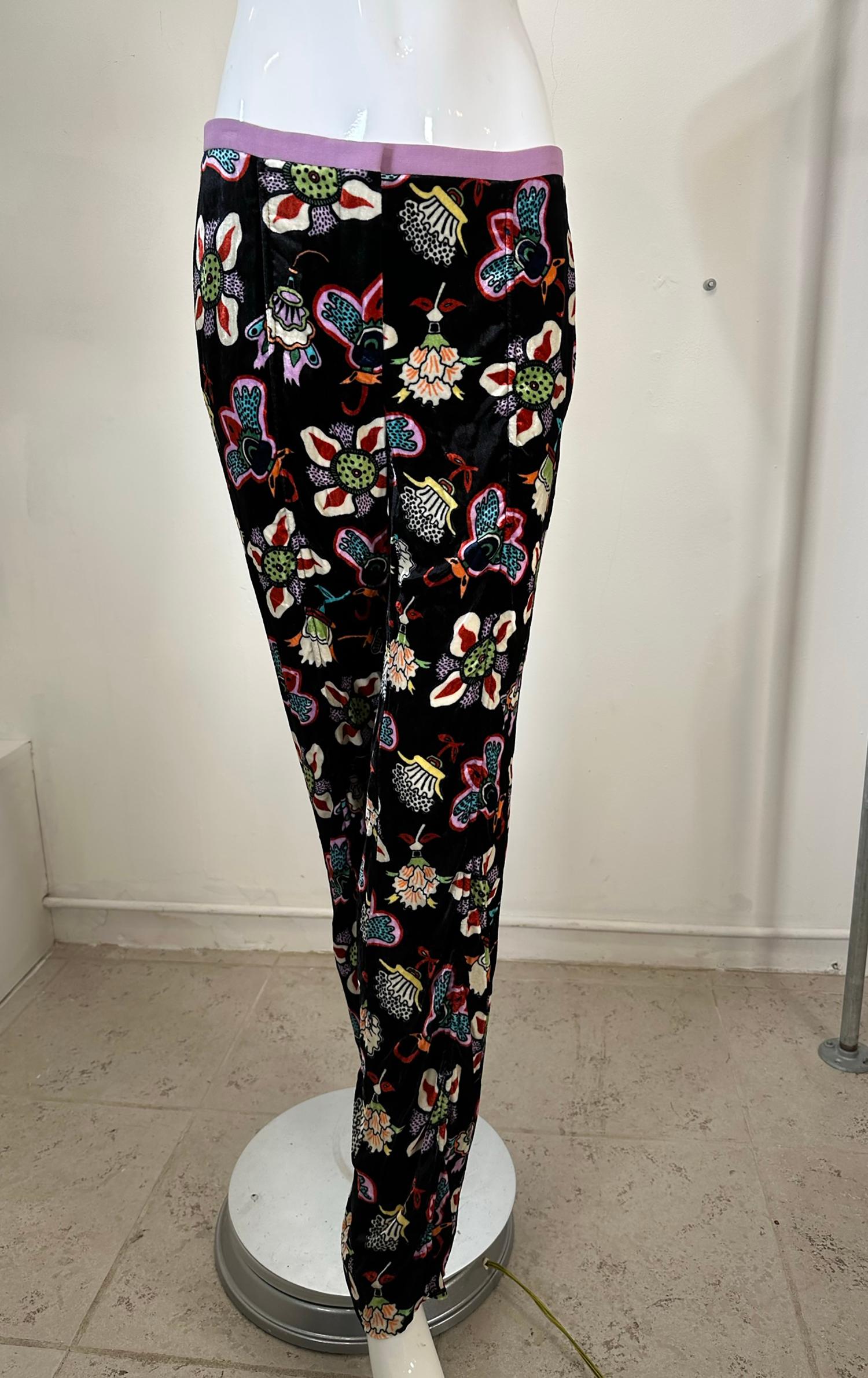 Valentino colourful abstract printed black velvet trousers. Narrow purple linen waist band trouser with fly front, button & bar hook, pant sits below natural waist. On seam side pockets. Rear hip pockets. The print is done in bright primary colours.