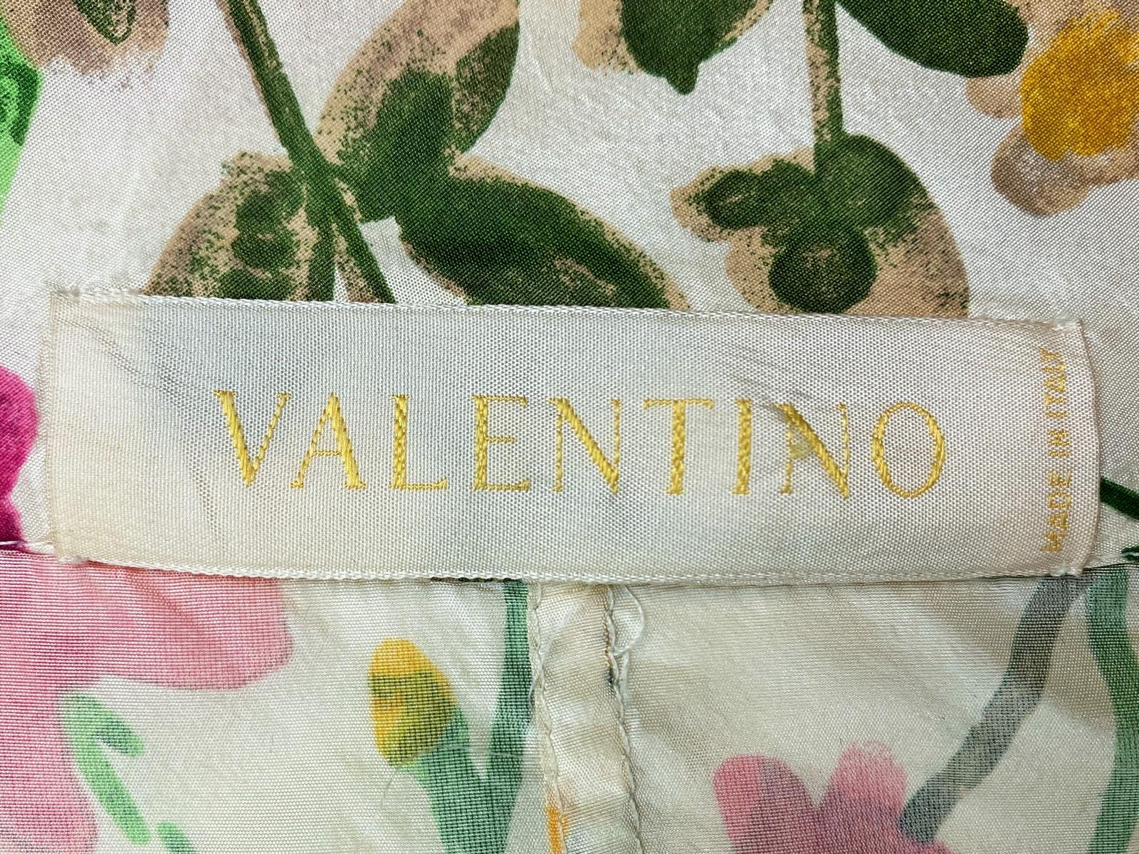 Circa 2010

Italy

Summer dress and coat set in floral silk taffeta by the famous Italian luxury fashion house Valentino.  100% silk taffeta printed with floral stems that appear to have been painted in gouache, giving it a fresh look. Sleeveless