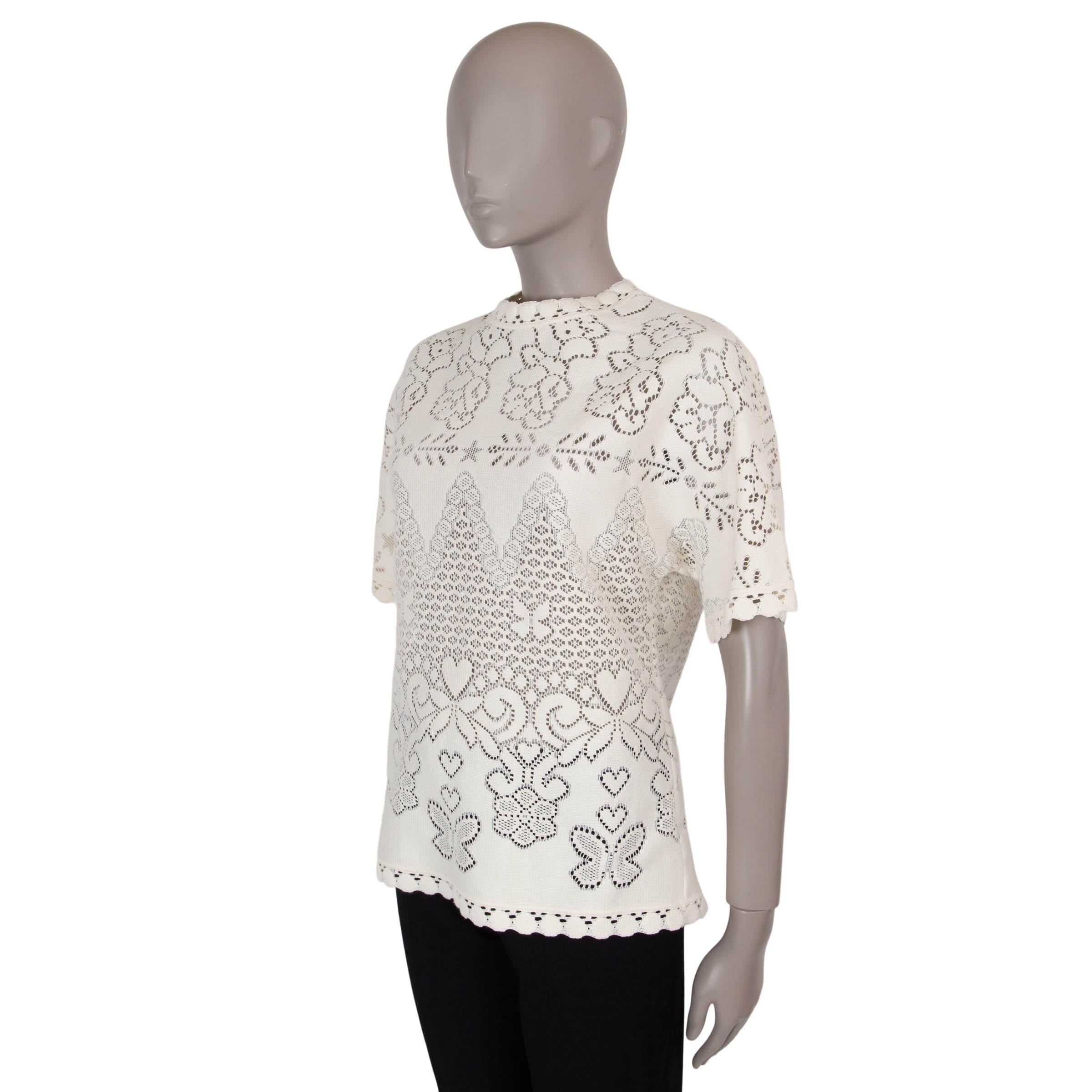 This 100% authentic Valentino top in Almond (cream) cotton (80%) and polyamide (20%) showcases delicate floral pointelle detailing. Designed with a relaxed silhouette, it features a crewneck, short sleeves, and crochet trims for an elegant finish.