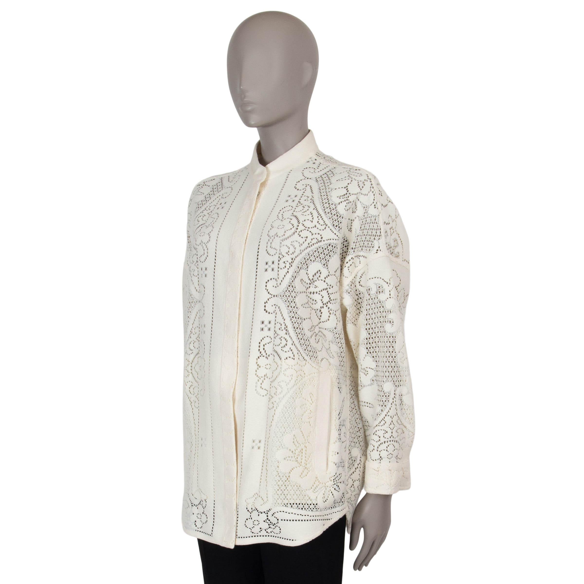 This 100% authentic Valentino shirt jacket in Almond (cream) cotton (80%) and polyamide (20% - please note the content and size tag are missing) showcases intricate floral pointelle detailing. Featuring a relaxed silhouette, it is designed with a