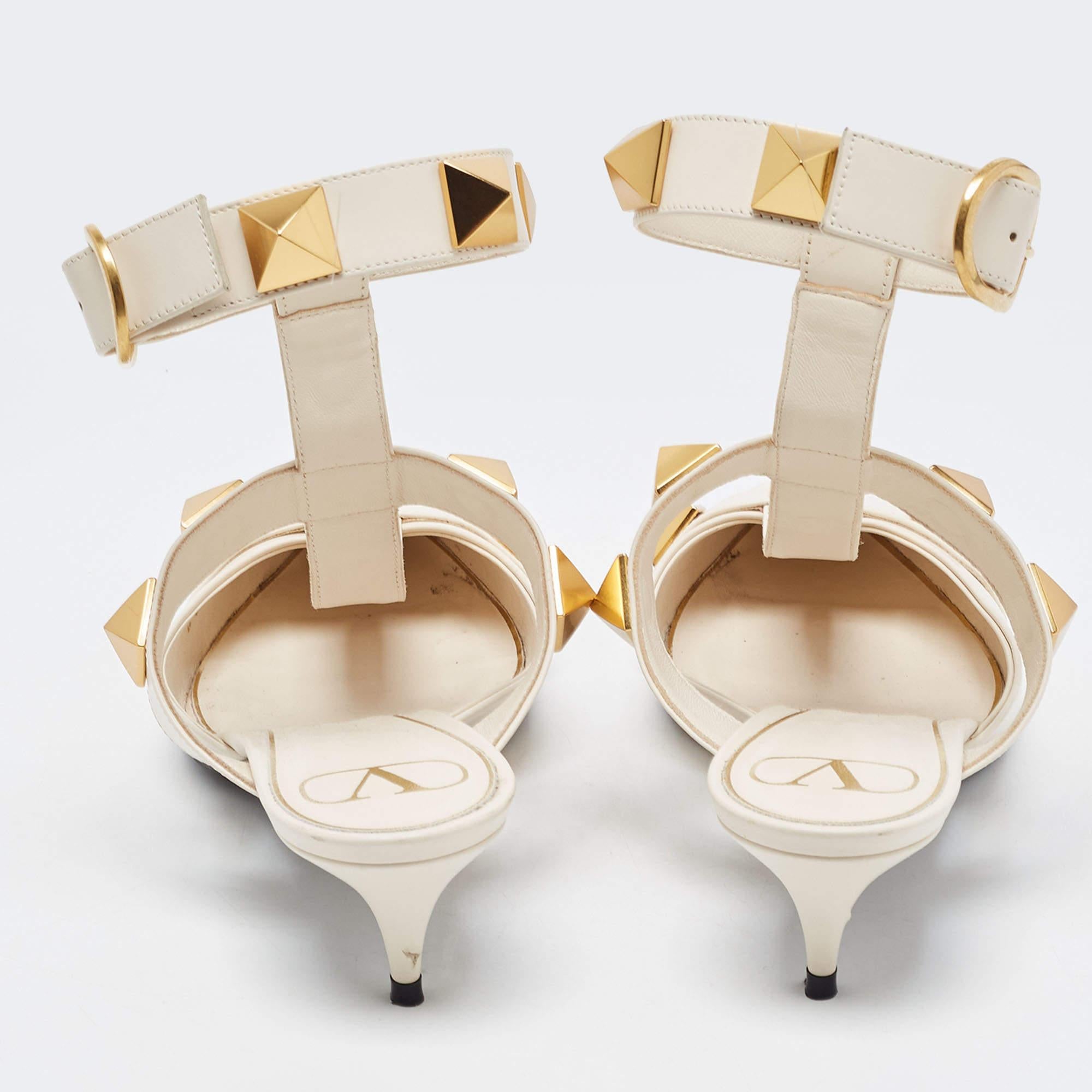 Valentino shoes are known for their unique designs that emanate the label's feminine verve and immaculate craftsmanship that makes their creations last season after season. Crafted from leather in a versatile cream shade, the straps are adorned with