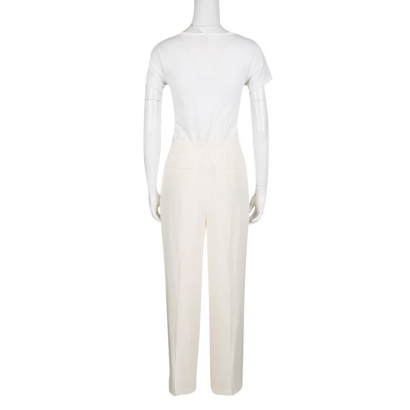 These Valentino trousers have been designed with just the perfect style details, like the wide leg, the high-waist and button accents. The trousers are crafted entirely from silk and have crisp front pleats. Team them up with a fitted blazer and