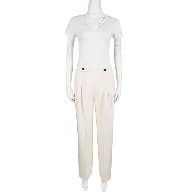 These Valentino trousers have been designed with just the perfect style details, like the wide leg, the high-waist and button accents. The trousers are crafted entirely from silk and have crisp front pleats. Team them up with a fitted blazer and